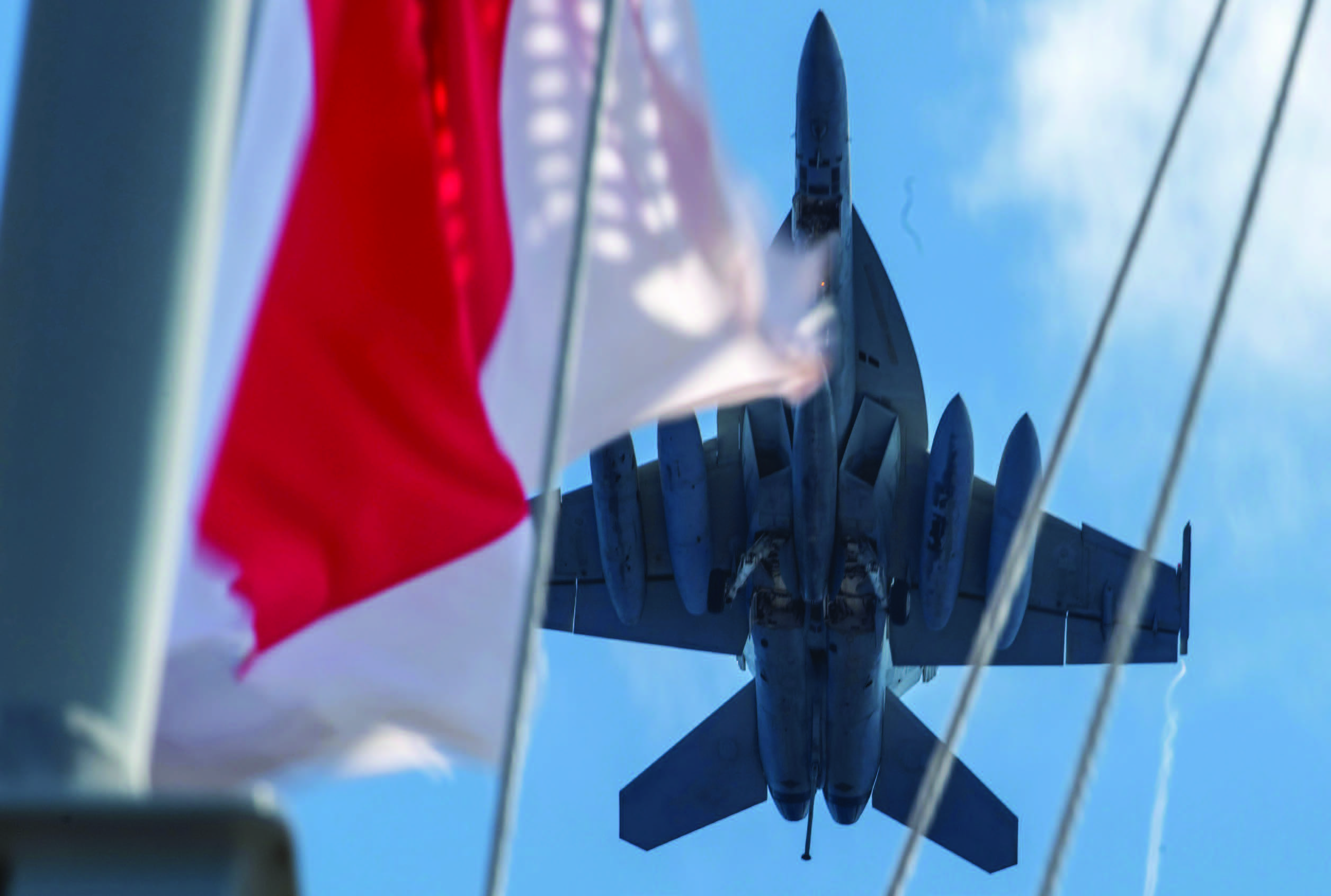 F/A-18E Super Hornet attached to Royal Maces of Strike Fighter Squadron 27 flies over Navy’s only forward-deployed aircraft carrier USS Ronald Reagan during flight operations in support of Valiant Shield 2024, Philippine Sea, June 11, 2024 (U.S. Navy/Kevin Steffanson)